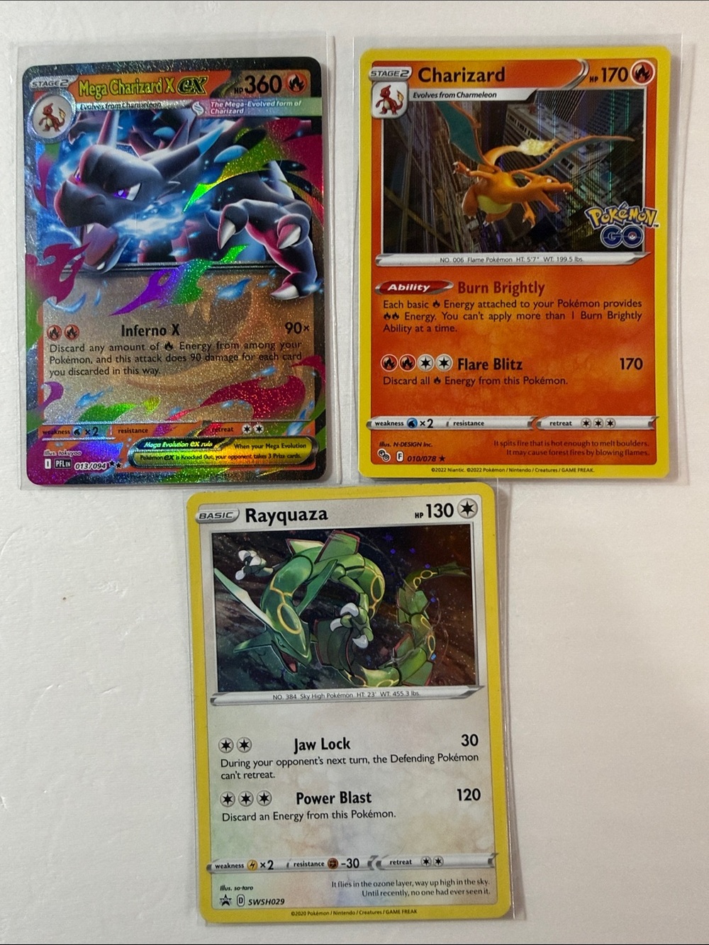 Pokemon Charizard & Rayquaza Card Trio - Orange, Green & Multicolor